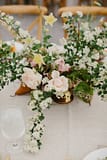 Centerpiece of blush roses by Nectar and Root, Vermont wedding florist at Shelburne Coach Barn in Shelburne, Vermont.