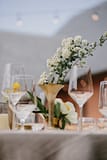Eclectic gold bud vase centerpiece by Nectar and Root, Vermont wedding florist at Shelburne Coach Barn in Shelburne, Vermont.