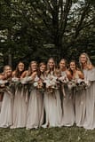 Bride and bridesmaids at romantic fall outdoor private estate holding modern September bridal and bridesmaids' bouquets of garden roses, hanging amaranth, sweet peas, dahlias, cosmos and zinnias in a warm neutrals palette by Nectar and Root, Vermont wedding florist at Edson Hill in Stowe, Vermont.