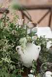 Lush neutral greenery centerpiece by Nectar and Root, Vermont wedding florist at Shelburne Museum in Shelburne, Vermont.