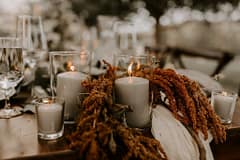 Outdoor elopement summer candlelit June reception centerpiece with amaranth by Nectar and Root, Vermont wedding florist at a backyard wedding in Vermont.